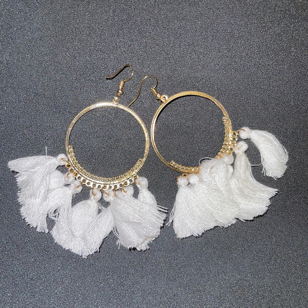 Gold earrings with white tassels